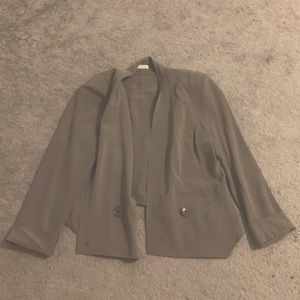 Women’s taupe blazer with shoulder pads.